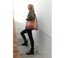 Orange and black bag with long handle.