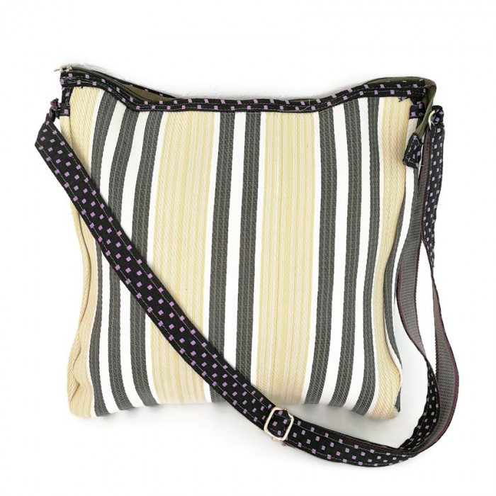 Pale yellow and black bag with long handle.