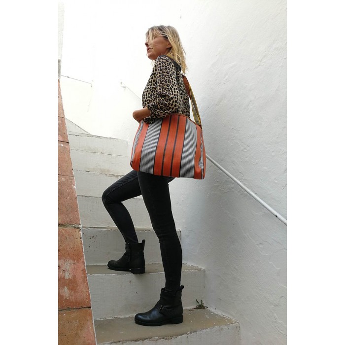 Orange and black bag with long handle.